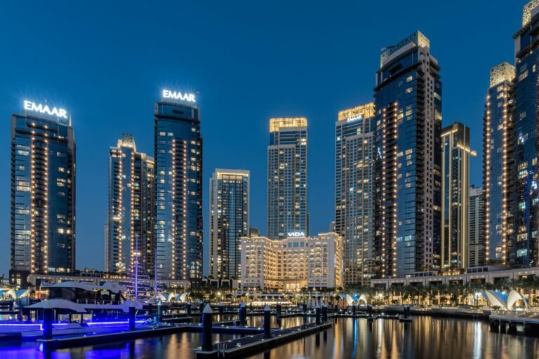 A breathtaking view of the illuminated skyscrapers at Dubai Marina during night.