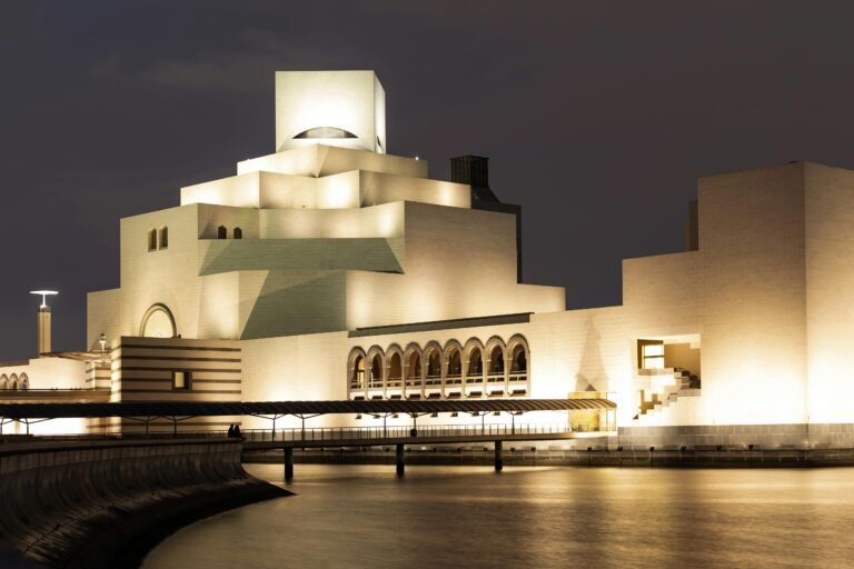 Stunning night view of the Museum of Islamic Art in Doha, Qatar, beautifully illuminated.